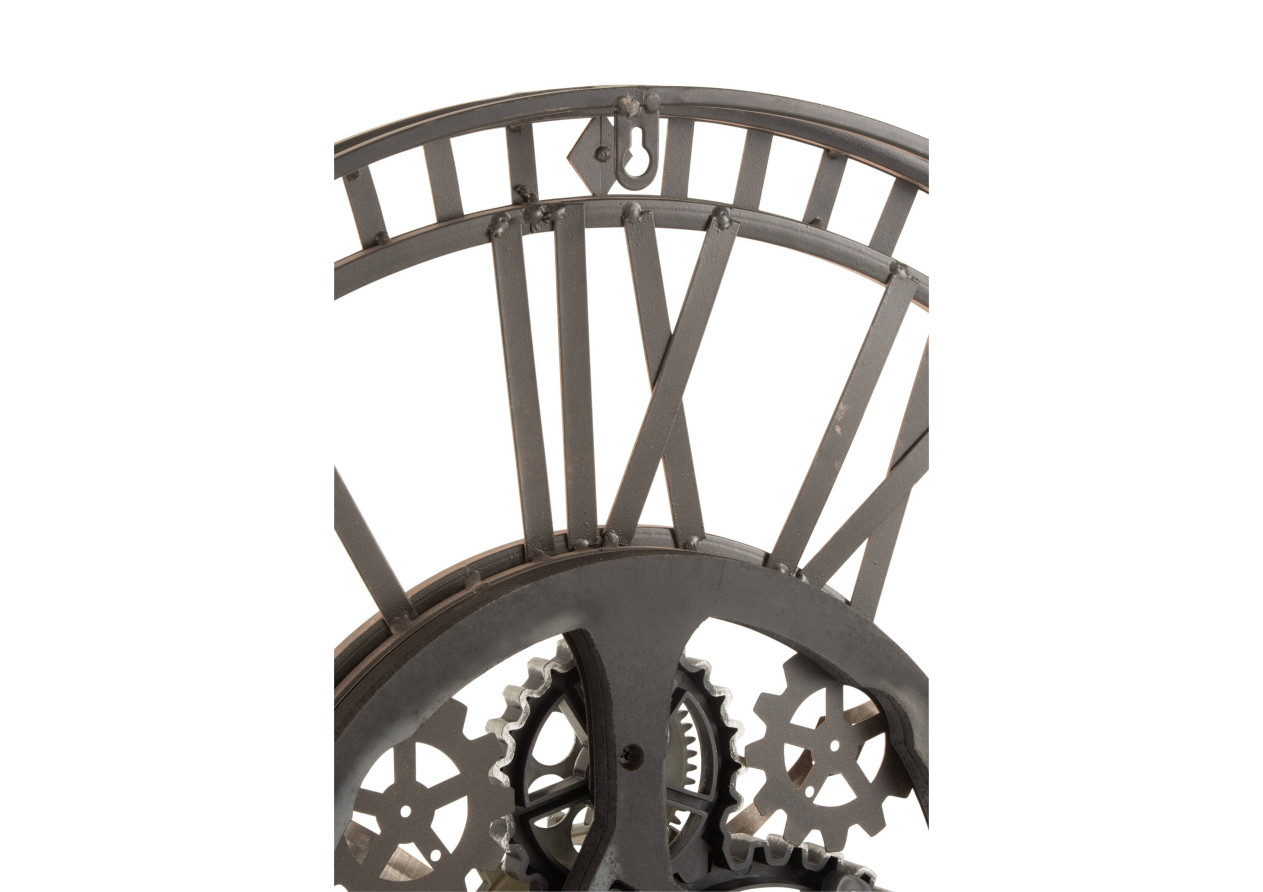 Horloge en chiffres romains, mécanisme visible, métal doré antique